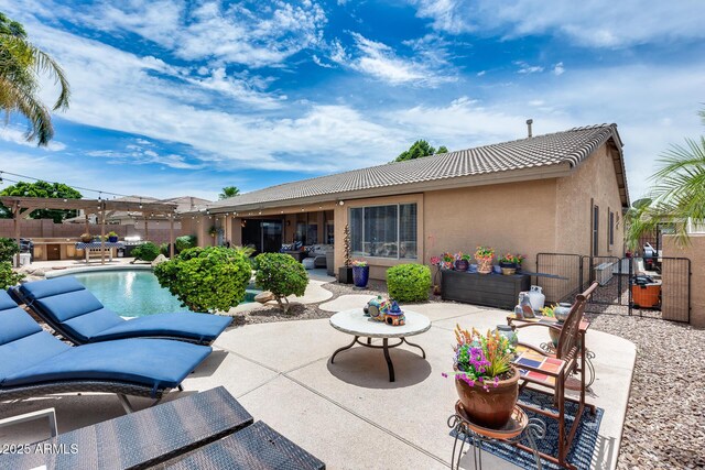 8738 W Runion Dr, Peoria, AZ 85382 - rear view of property with a tile roof, a patio, stucco siding, and a fenced backyard