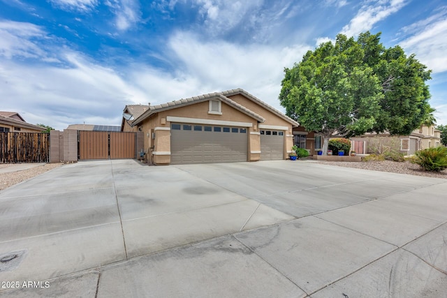 8738 W Runion Dr, Peoria, AZ 85382 - ranch-style home featuring a gate, stucco siding, driveway, a garage, and a tiled roof