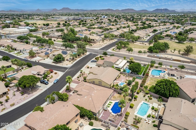 8738 W Runion Dr, Peoria, AZ 85382 - aerial perspective of suburban area with a pool area and a mountainous background