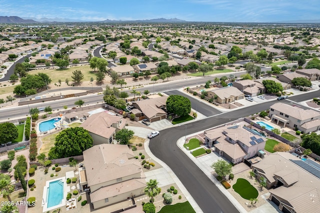 8738 W Runion Dr, Peoria, AZ 85382 - aerial perspective of suburban area featuring a pool and a mountainous background