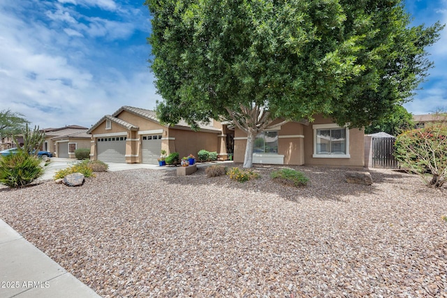 8738 W Runion Dr, Peoria, AZ 85382 - view of front of home with stucco siding, an attached garage, and concrete driveway