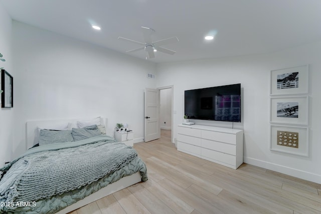 bedroom with light wood finished floors, baseboards, visible vents, lofted ceiling, and recessed lighting