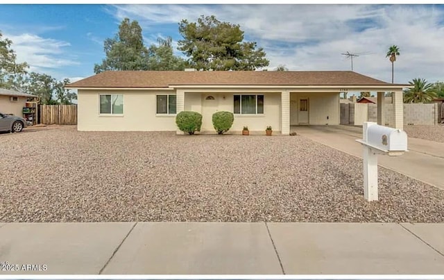 ranch-style home featuring a carport