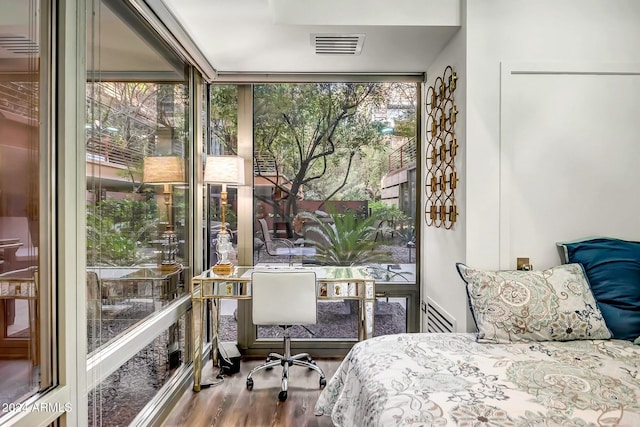 bedroom with hardwood / wood-style floors