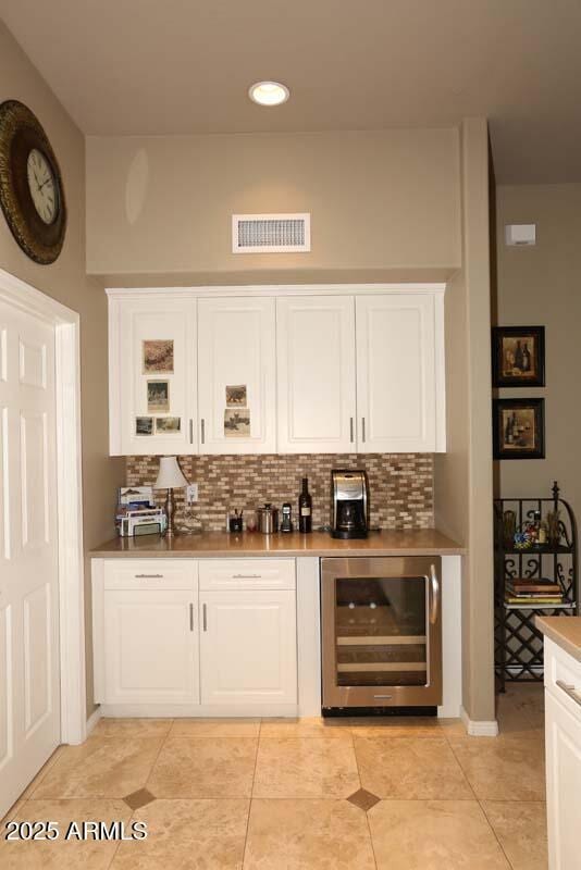 32764 N 68th Pl, Scottsdale, AZ 85266 - bar with bar, decorative backsplash, beverage cooler, and visible vents