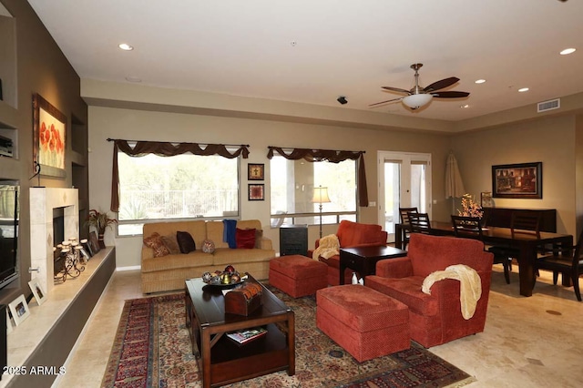 32764 N 68th Pl, Scottsdale, AZ 85266 - living room with a tiled fireplace, visible vents, recessed lighting, and ceiling fan