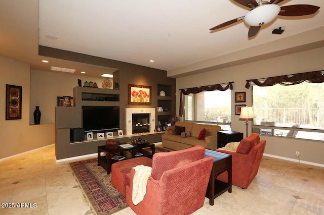 32764 N 68th Pl, Scottsdale, AZ 85266 - living area featuring a glass covered fireplace, tile patterned flooring, recessed lighting, and ceiling fan