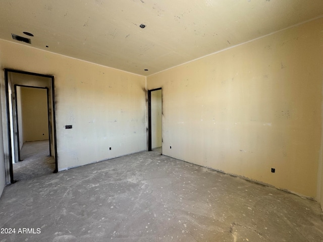 empty room with concrete flooring