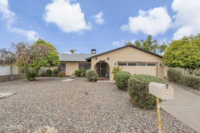 single story home featuring a garage