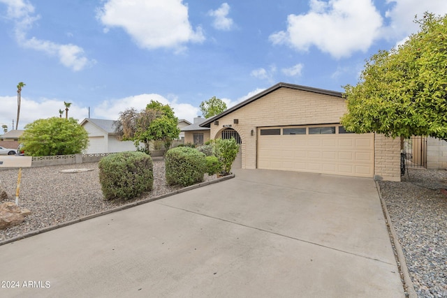 single story home featuring a garage