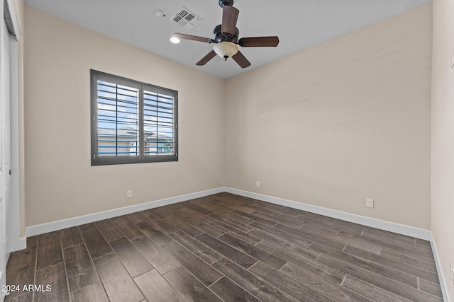 unfurnished room featuring ceiling fan and dark hardwood / wood-style flooring