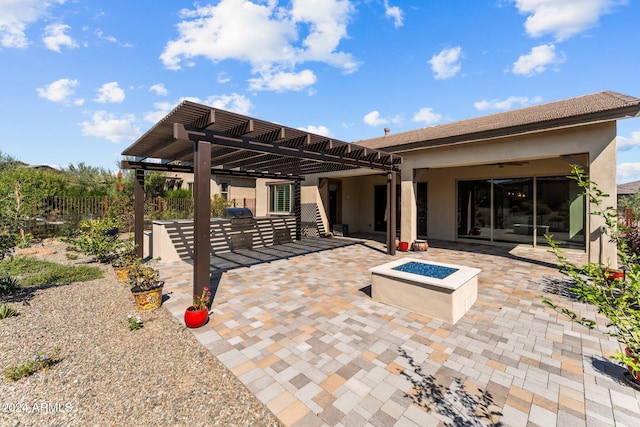 view of patio / terrace featuring a pergola and a fire pit