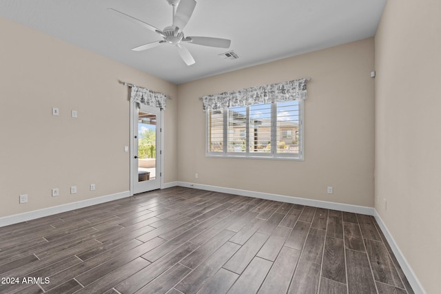 unfurnished room with ceiling fan and dark hardwood / wood-style flooring