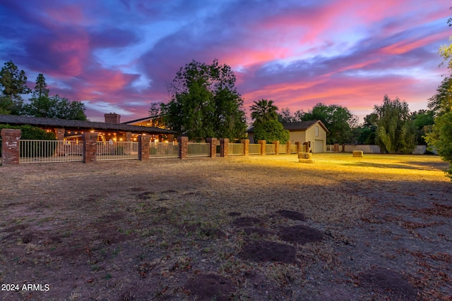 view of yard at dusk