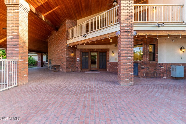 view of patio featuring a balcony