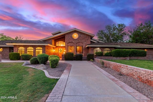 view of front of home with a lawn