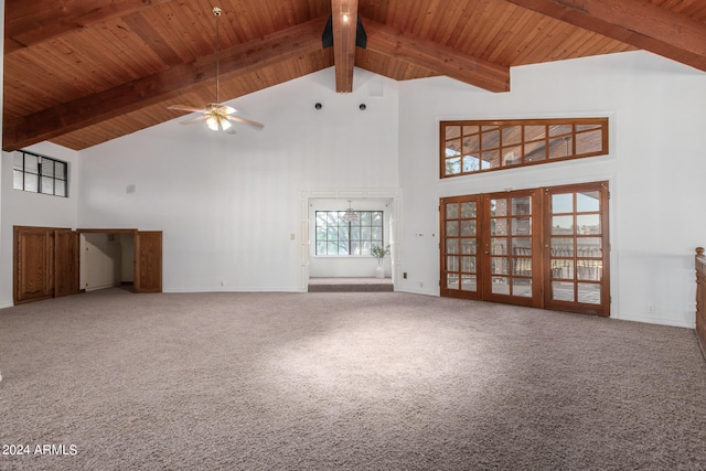 unfurnished living room featuring high vaulted ceiling, carpet, and ceiling fan