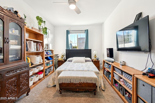 bedroom with ceiling fan and carpet