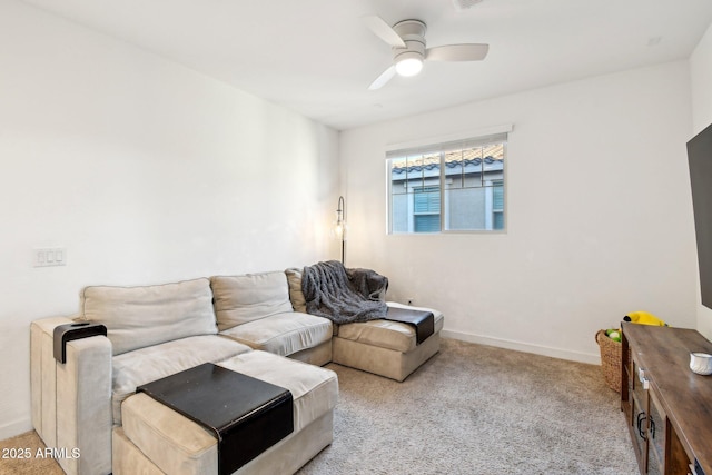 carpeted living room with ceiling fan