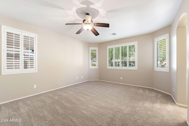 carpeted empty room with ceiling fan