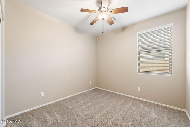 empty room with carpet flooring and ceiling fan