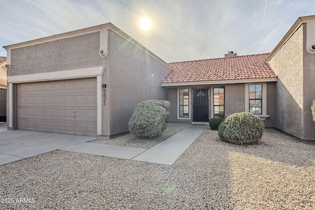 view of front of home with a garage