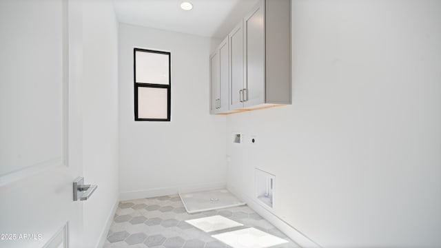 washroom with electric dryer hookup, baseboards, cabinet space, and hookup for a washing machine