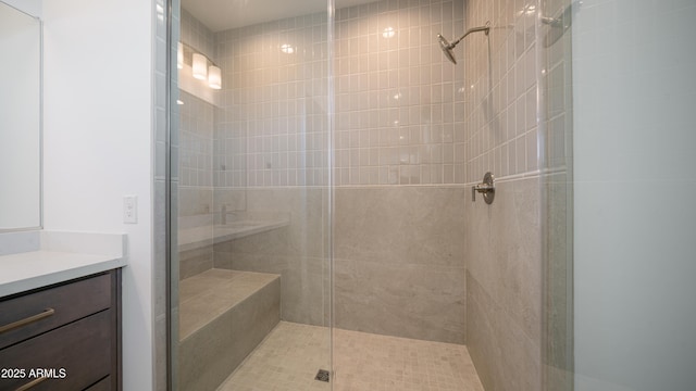 bathroom featuring a stall shower and vanity