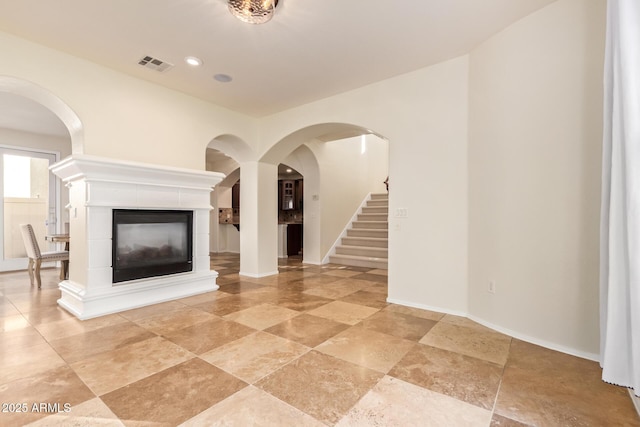 unfurnished living room with a fireplace