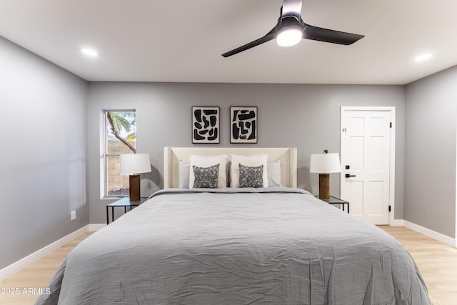 bedroom with light wood-type flooring and ceiling fan