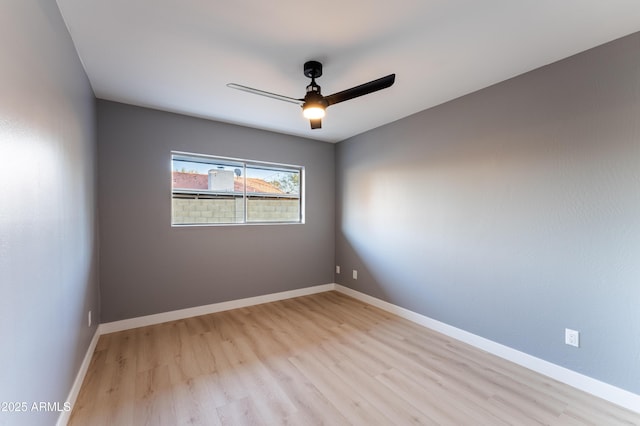 unfurnished room with ceiling fan and light hardwood / wood-style floors