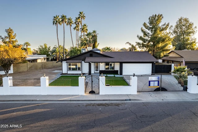 view of front of property with a garage