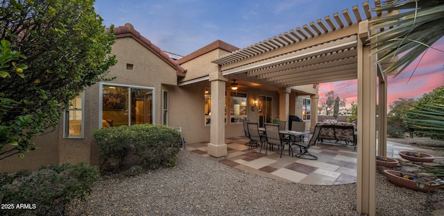 patio terrace at dusk with a pergola