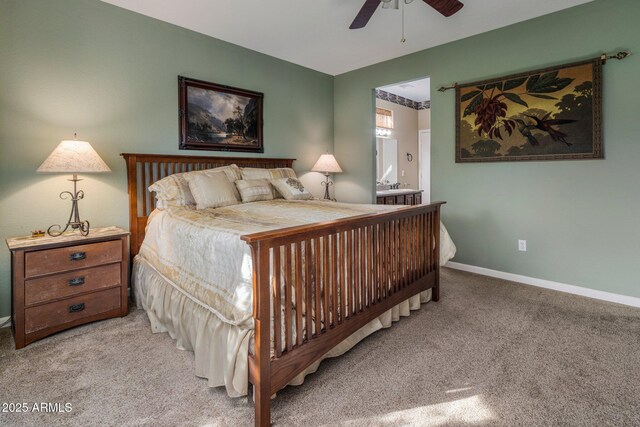 bedroom with connected bathroom, ceiling fan, and carpet flooring