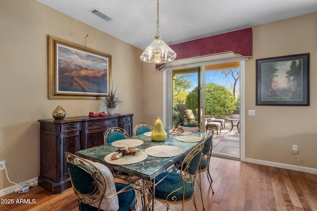 dining area with light hardwood / wood-style floors