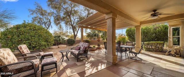 view of patio featuring ceiling fan and a pergola