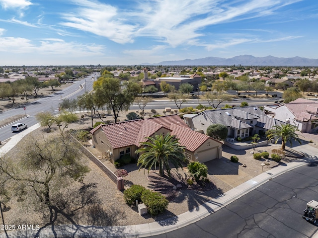 birds eye view of property featuring a mountain view