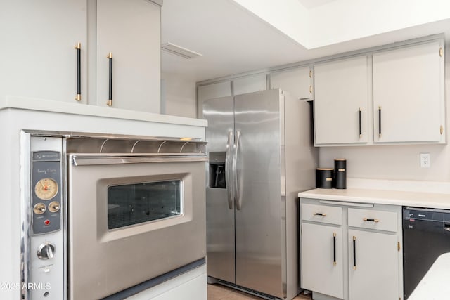8431 E Rose Ln, Scottsdale, AZ 85250 - kitchen with visible vents, stainless steel refrigerator with ice dispenser, dishwasher, light countertops, and light tile patterned flooring