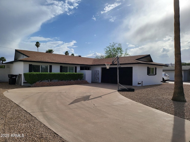 8431 E Rose Ln, Scottsdale, AZ 85250 - ranch-style house with driveway and an attached garage