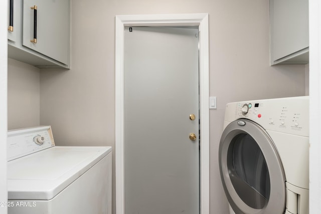 8431 E Rose Ln, Scottsdale, AZ 85250 - washroom featuring washing machine and clothes dryer and cabinet space