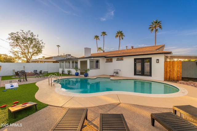 8431 E Rose Ln, Scottsdale, AZ 85250 - view of pool featuring french doors, a fenced backyard, a fenced in pool, and a patio