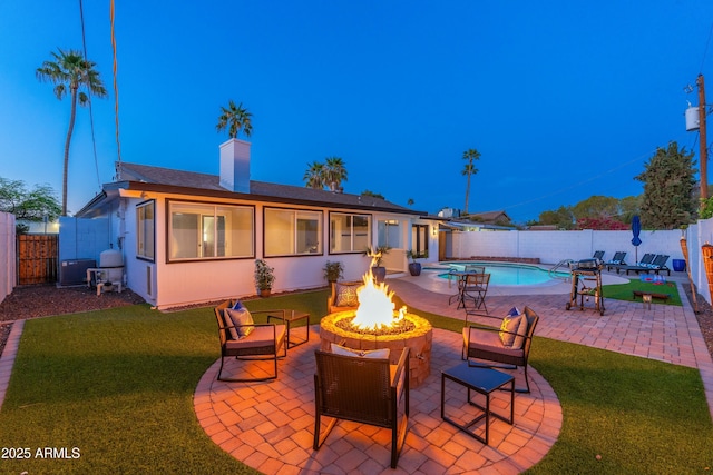 8431 E Rose Ln, Scottsdale, AZ 85250 - exterior space featuring a fenced in pool, a fenced backyard, and an outdoor fire pit
