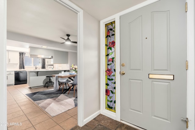 8431 E Rose Ln, Scottsdale, AZ 85250 - foyer with ceiling fan, tile patterned flooring, and baseboards