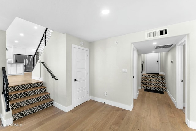 corridor featuring light hardwood / wood-style flooring