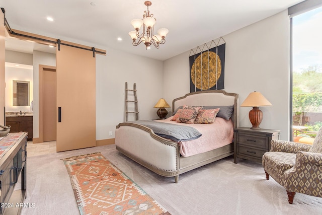 carpeted bedroom with connected bathroom, a barn door, a notable chandelier, and sink