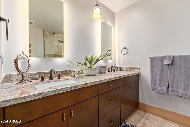 bathroom with vanity and an enclosed shower