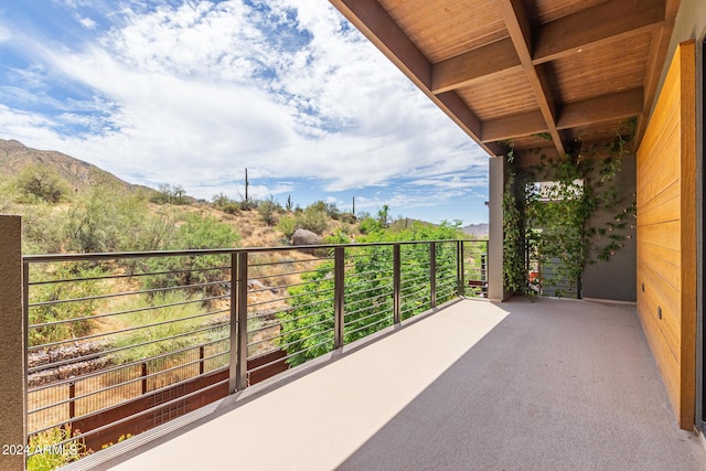 balcony featuring a mountain view