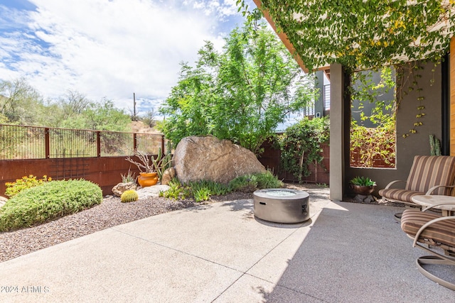 view of patio / terrace with an outdoor fire pit