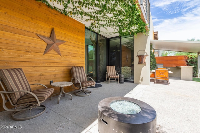 view of patio / terrace with a fire pit