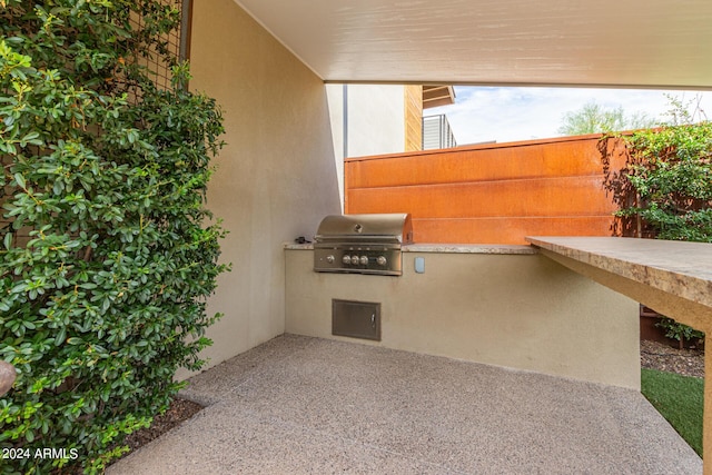 view of patio with a grill